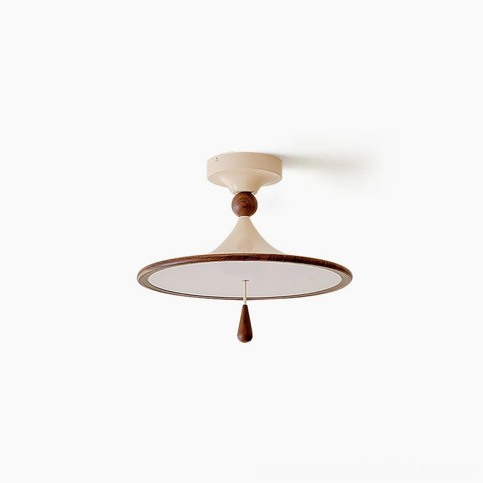Tomaso mid-century modern flush mount ceiling light with cream finish and walnut wood accent, overhead studio view