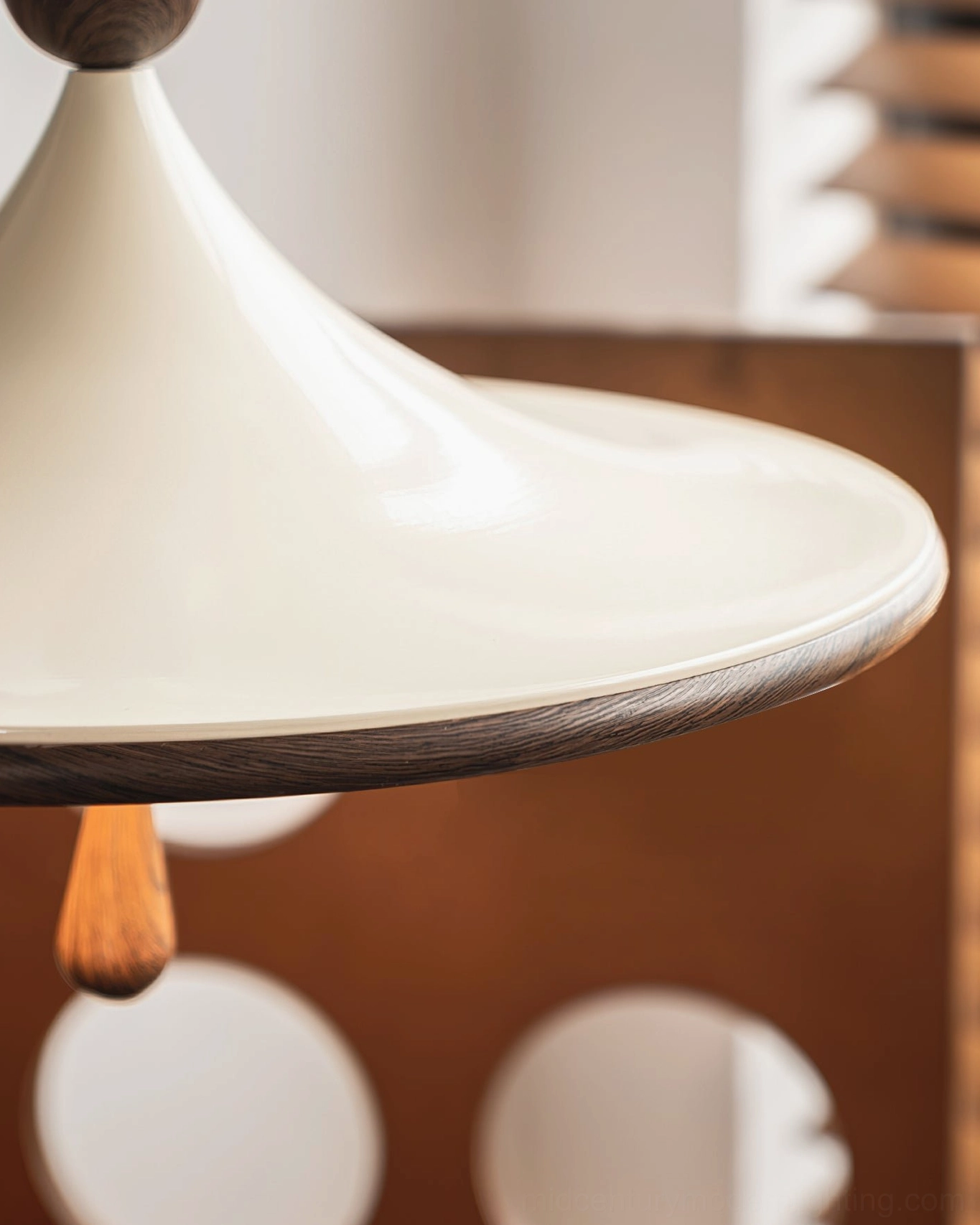 Side profile of Tomaso mid-century modern ceiling light showing cream finish, walnut rim, and teardrop wood accent