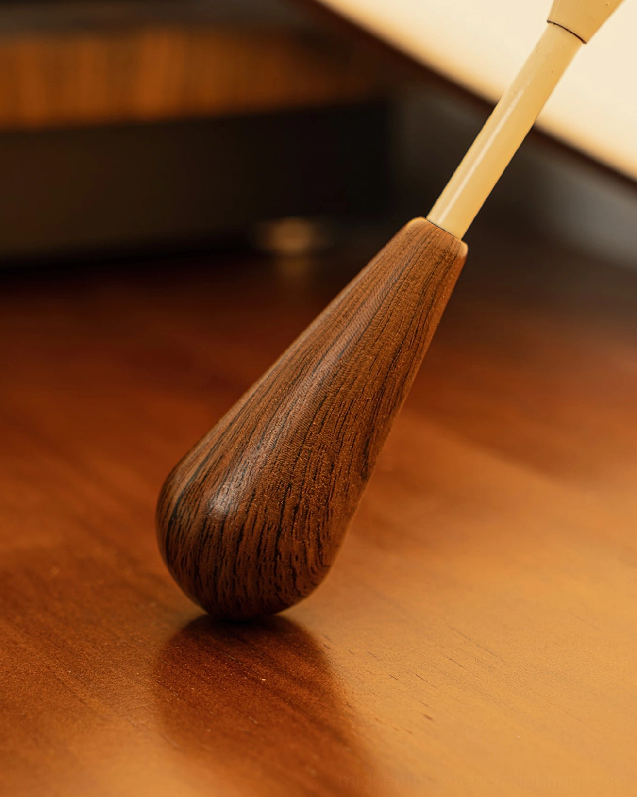 Tomaso ceiling light teardrop wooden pull detail in natural walnut with smooth polished finish on wood grain