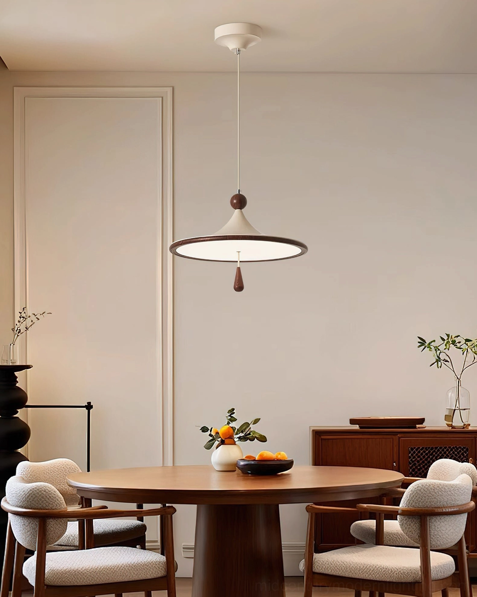 Tomaso pendant light in formal vintage dining room with upholstered chairs and warm neutral decor
