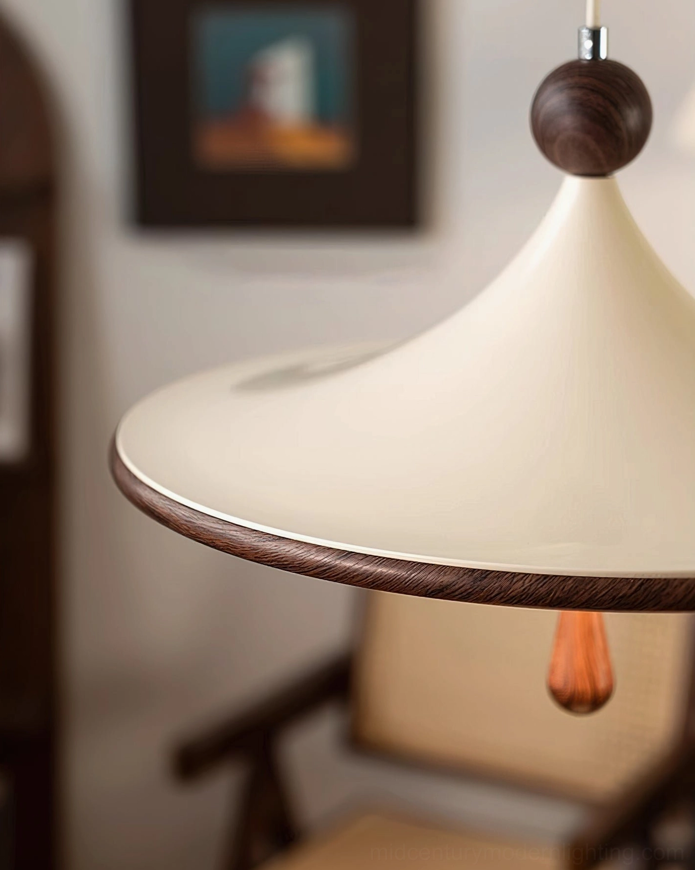Extreme close-up of Tomaso pendant light showing conical shade curve, wood trim and teardrop ornament detail