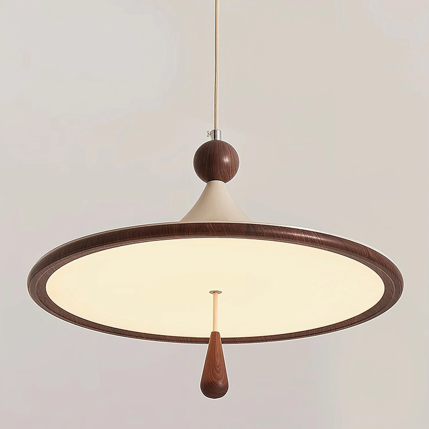 Tomaso mid-century modern pendant fixture with warm light creating ambient glow and shadow play