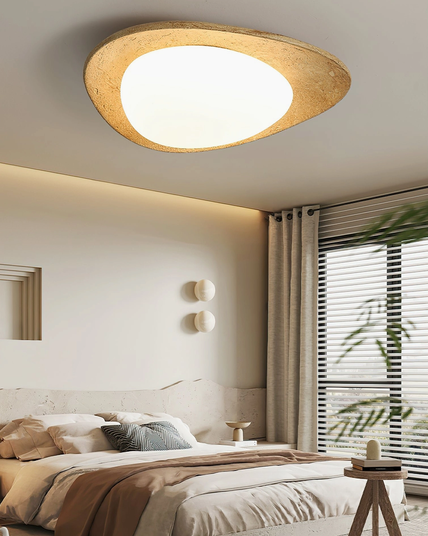 Topo wabi-sabi ceiling light cozy neutral bedroom low angle view curved wood base warm glowing acrylic diffuser