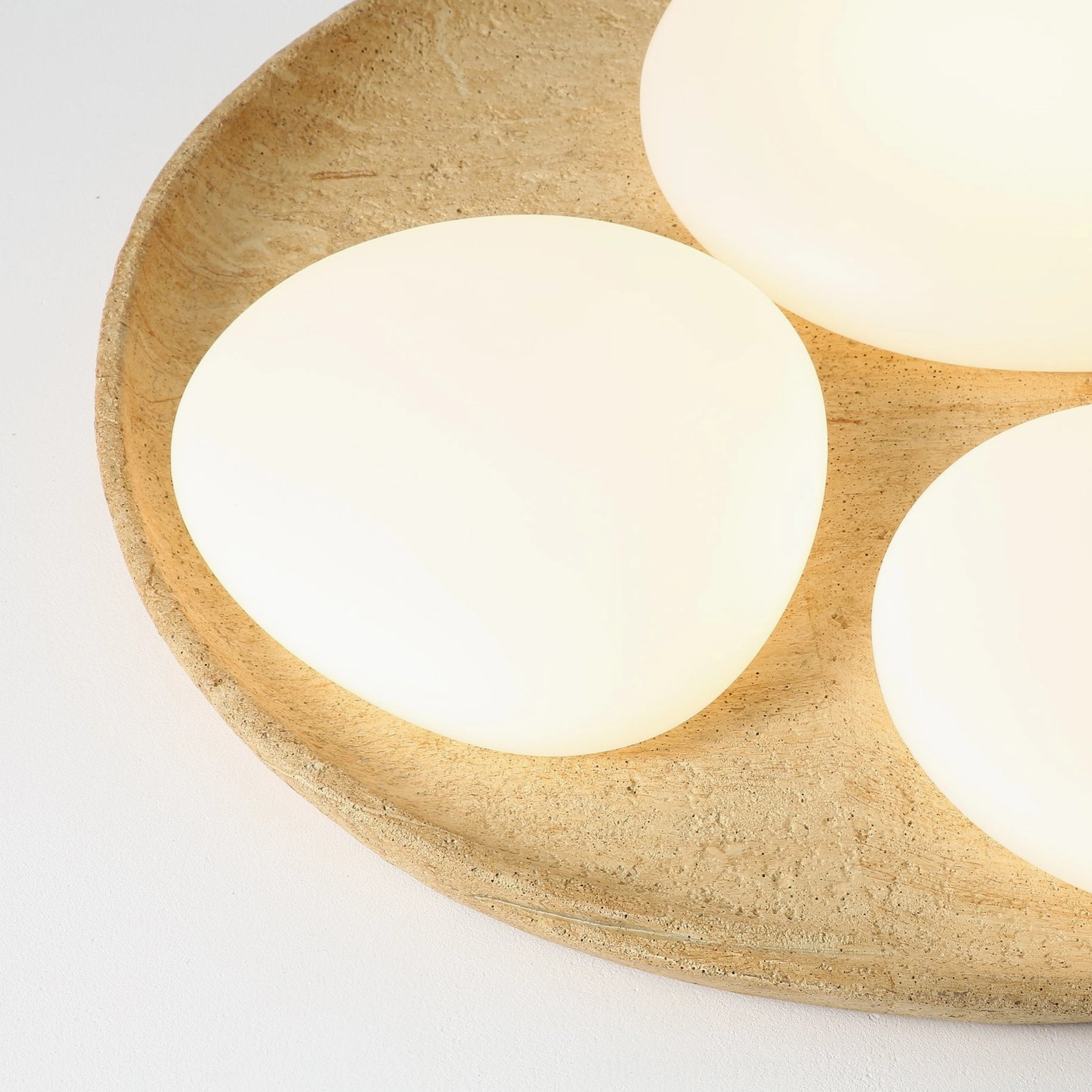 Topo minimalist ceiling light warm glow demonstration showing ambient lighting capability and frosted acrylic clarity