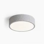 Toren brutalist ceiling light with speckled grey finish and white acrylic diffuser, front studio view