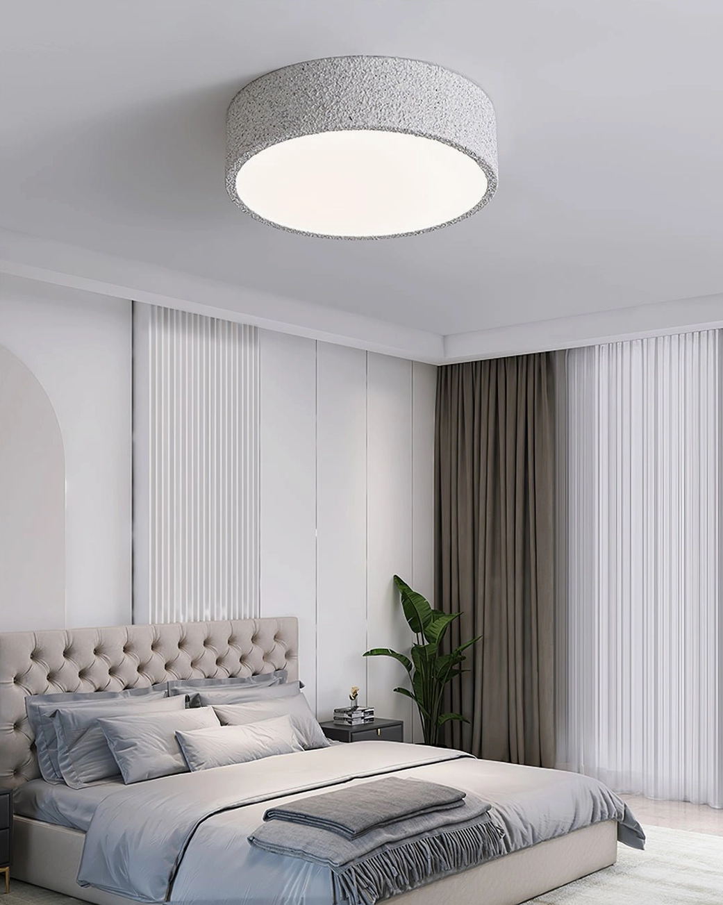 Toren brutalist ceiling fixture in bedroom with tufted headboard and floor plant