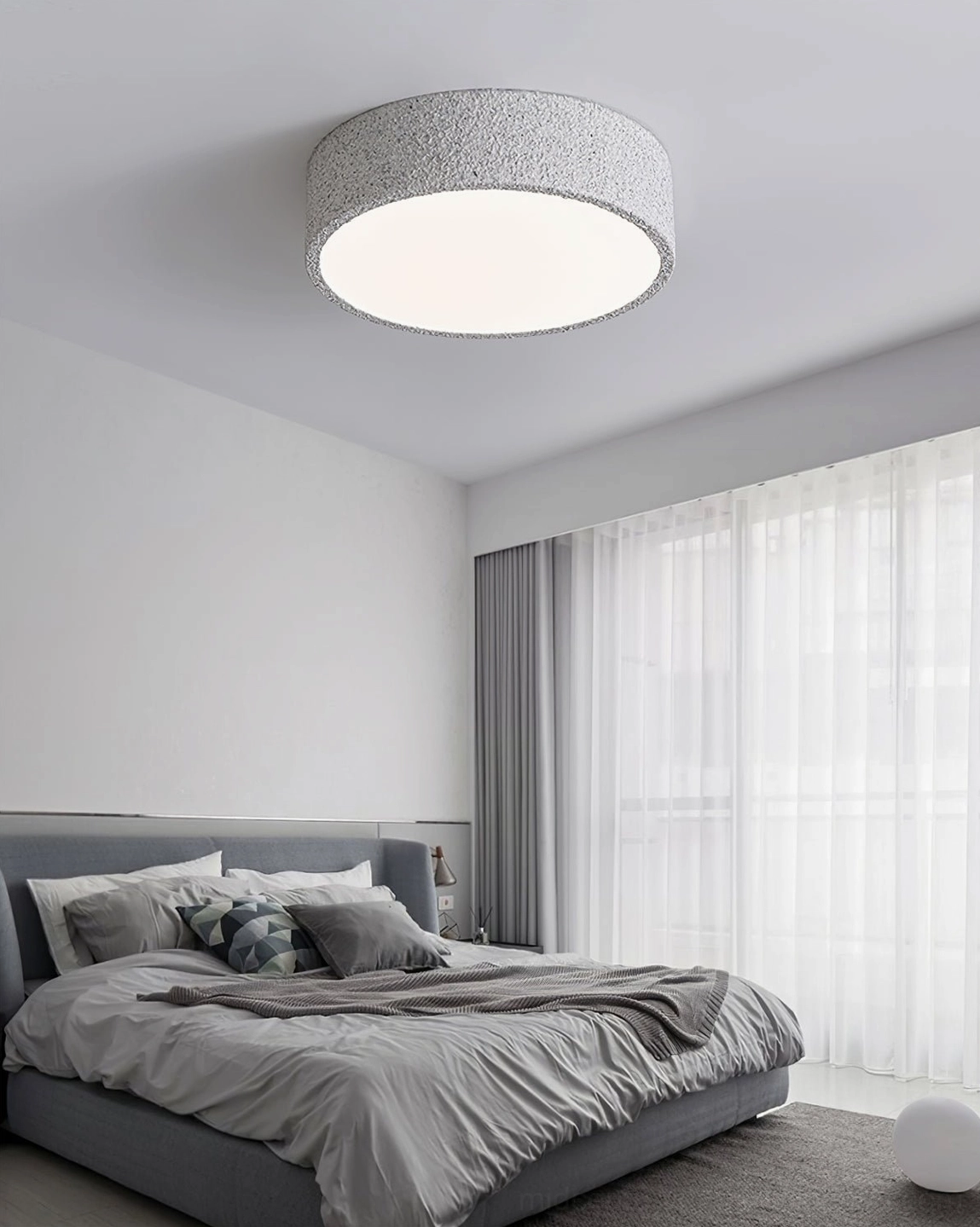 Toren minimalist flush mount light in bedroom with floor-to-ceiling curtains