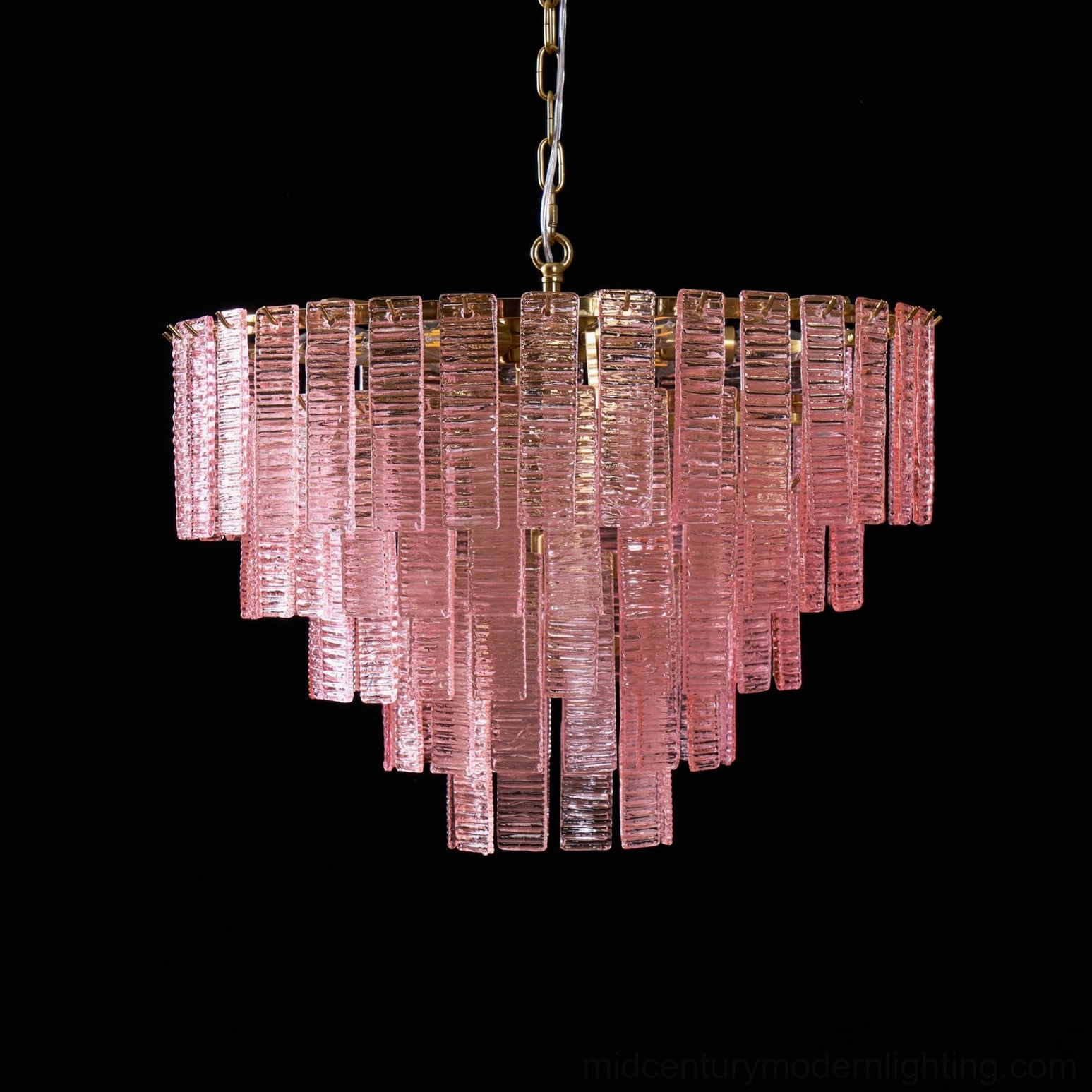 Toronto tiered chandelier frosted glass panels creating soft diffused lighting in interior space