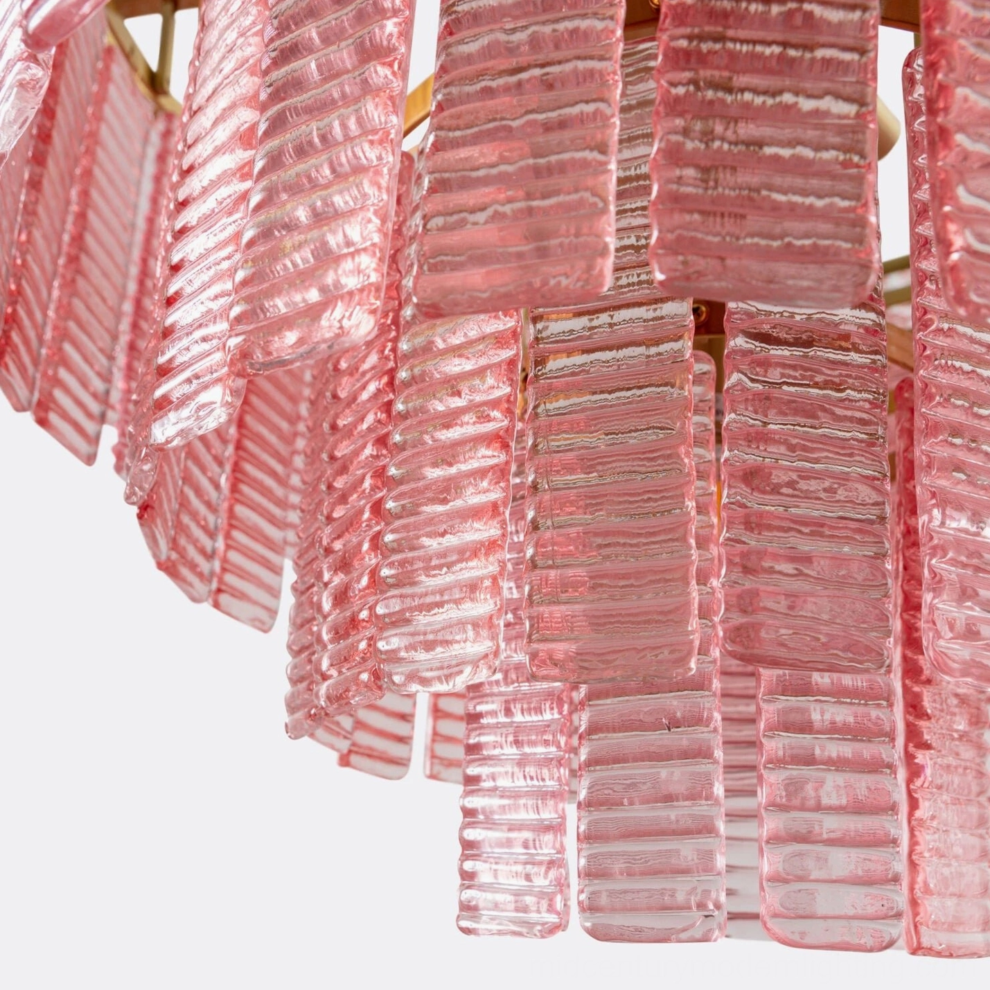 Close-up detail of Toronto chandelier ribbed glass panels showing texture and brass mounting fixtures