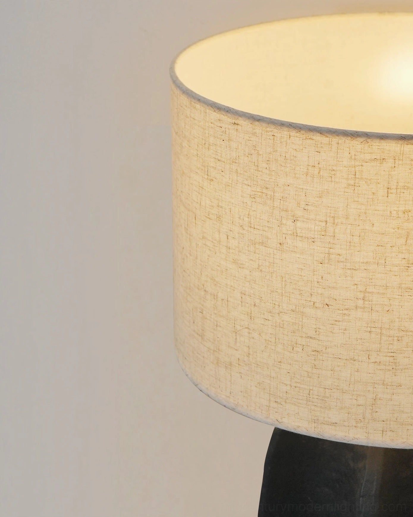 Torso table lamp in curated interior design living space composition