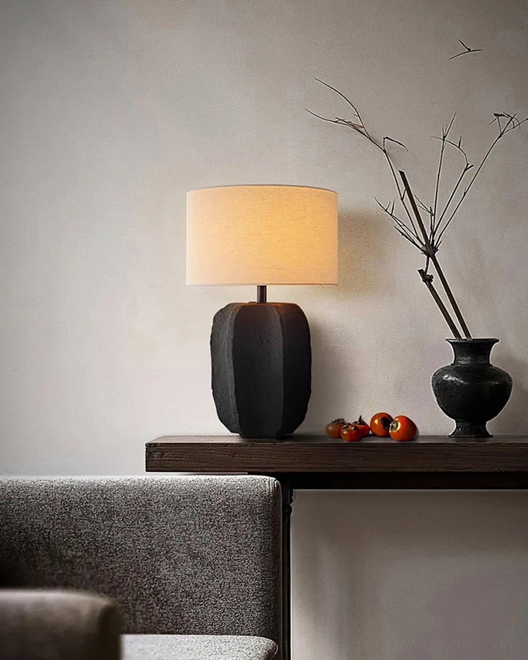 Torso table lamp on living room side table paired with dried flower vase decoration