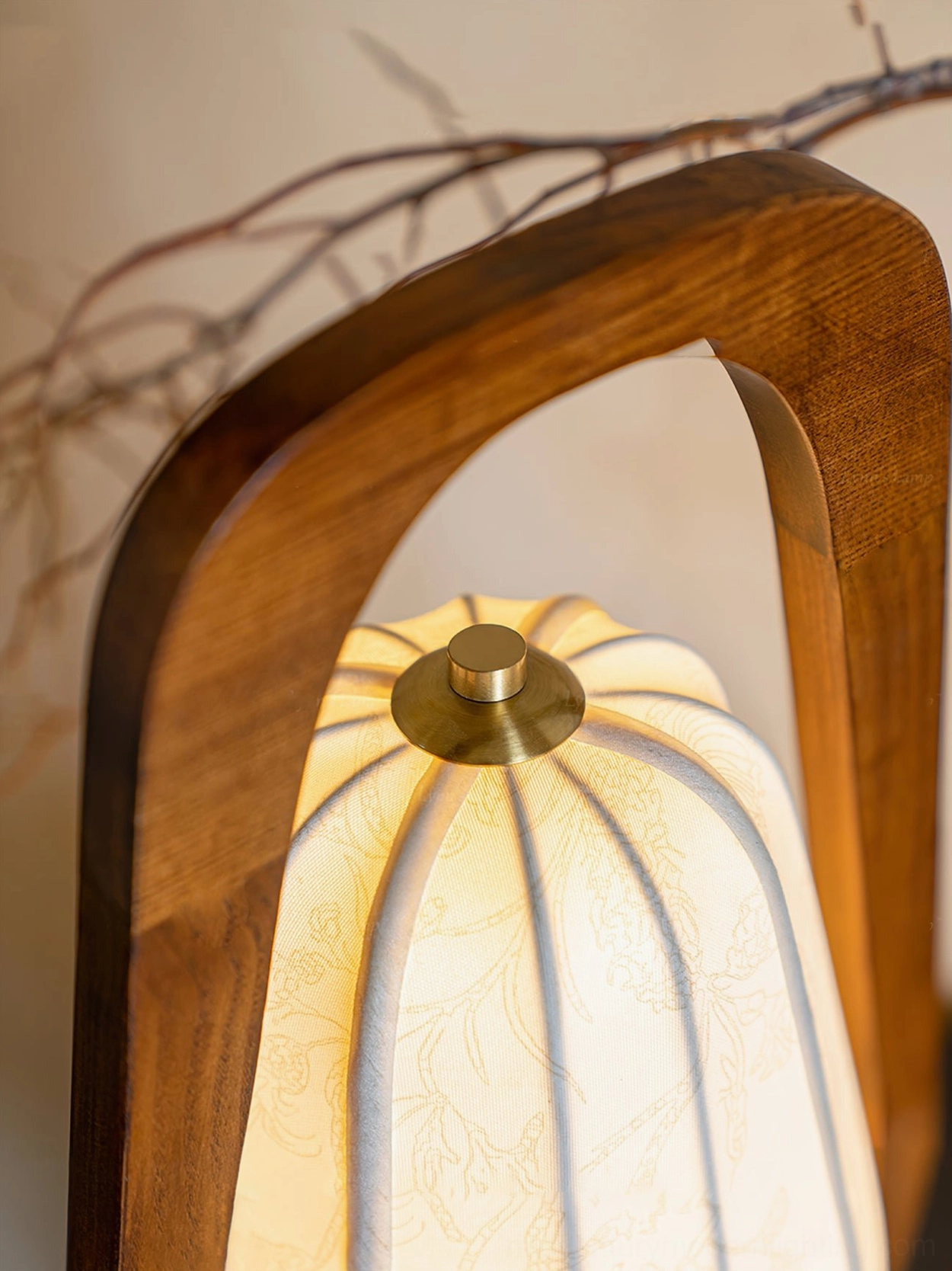 Close-up overhead view of Totem lamp shade showing ribbed fabric texture, subtle floral pattern, and brass metal top fixture