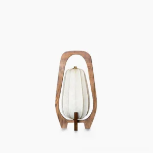 Totem wood table lamp with fabric shade on minimalist white background, front flat view showcasing mid-century modern design