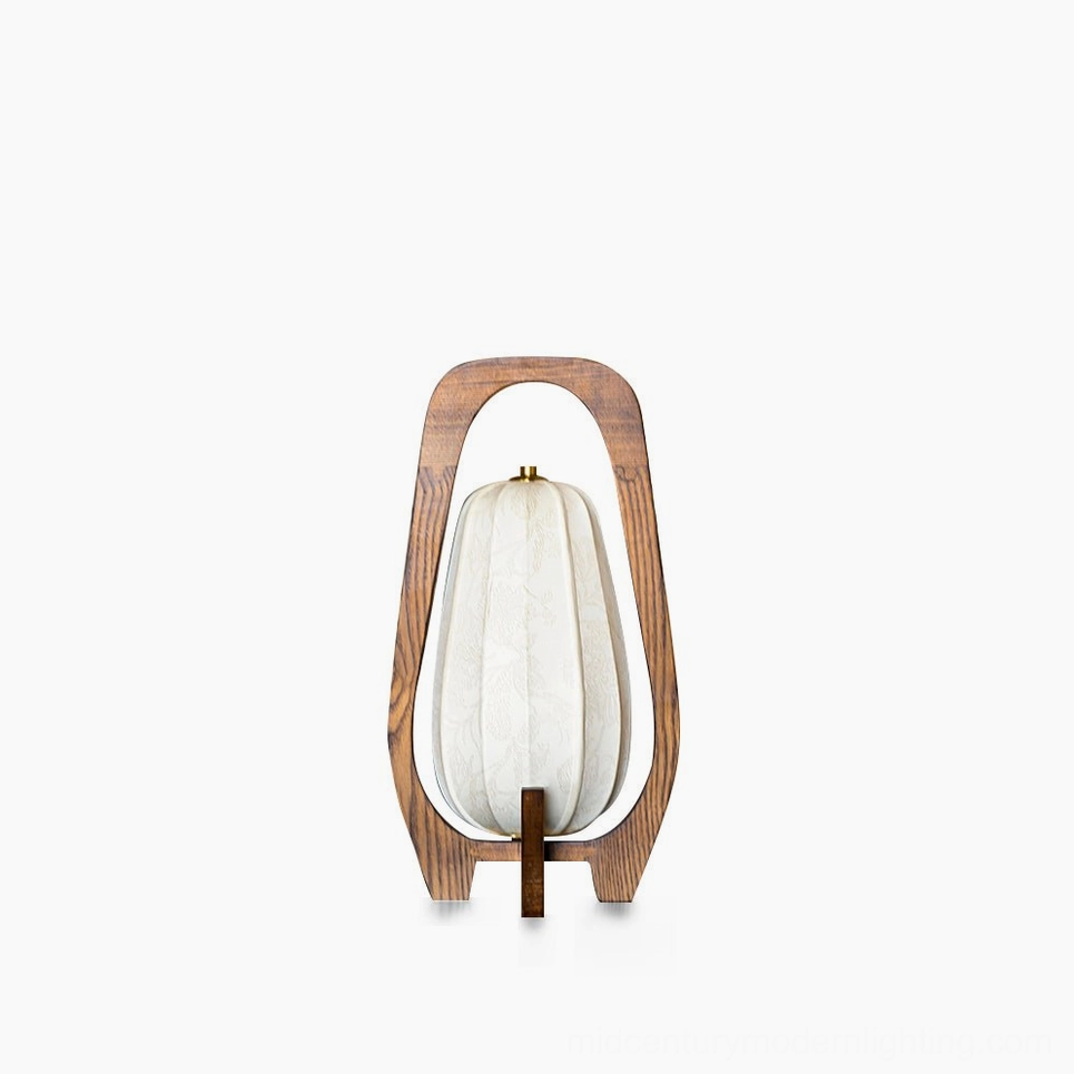 Totem wood table lamp with fabric shade on minimalist white background, front flat view showcasing mid-century modern design