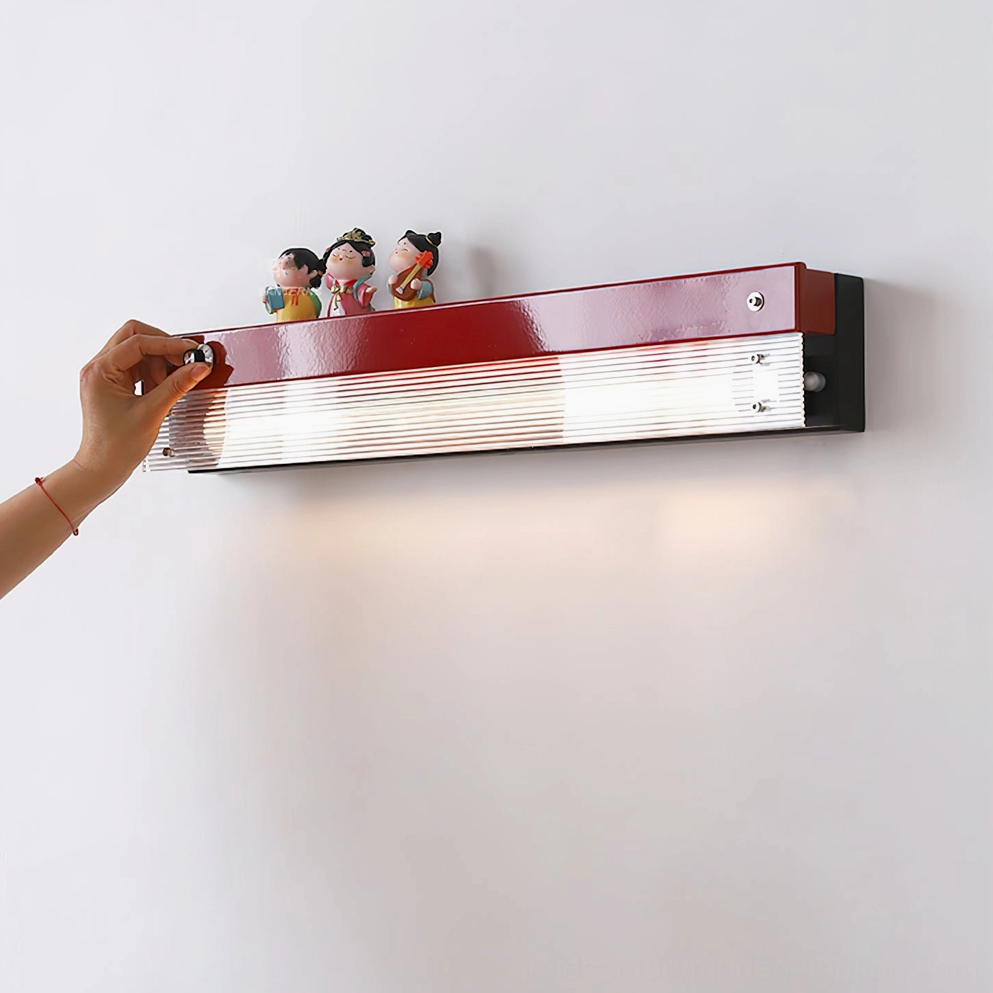 Totem wall lamp side angle showing shelf depth and ribbed diffuser architectural detail
