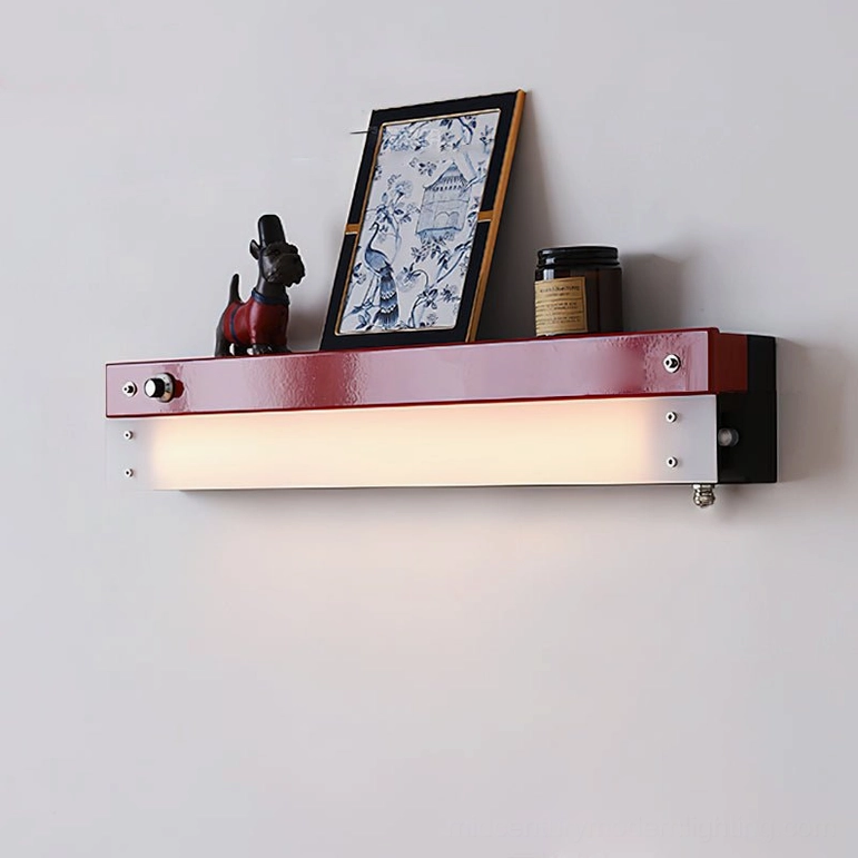Illuminated Totem wall lamp with framed art and burgundy metal finish on display