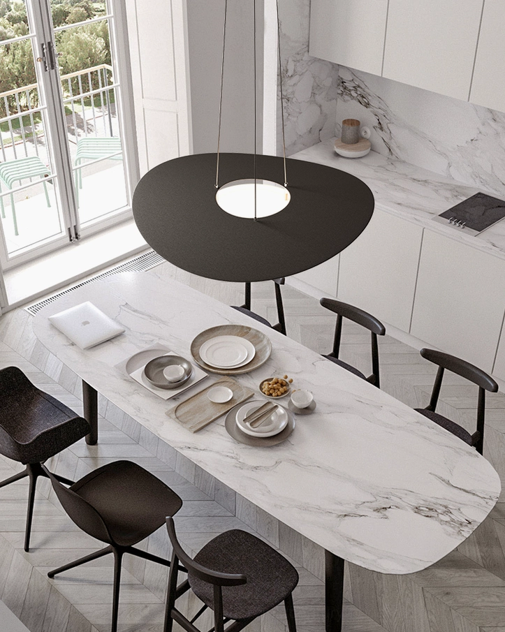 Black Towers disc pendant suspended above luxury marble dining table