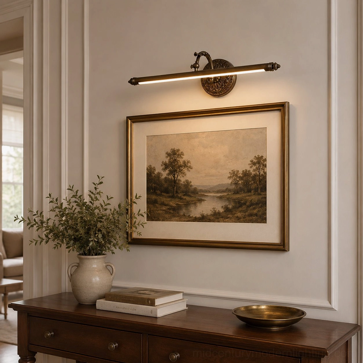 Brass wall picture light with ornate circular backplate mounted in traditional living room above decorative console