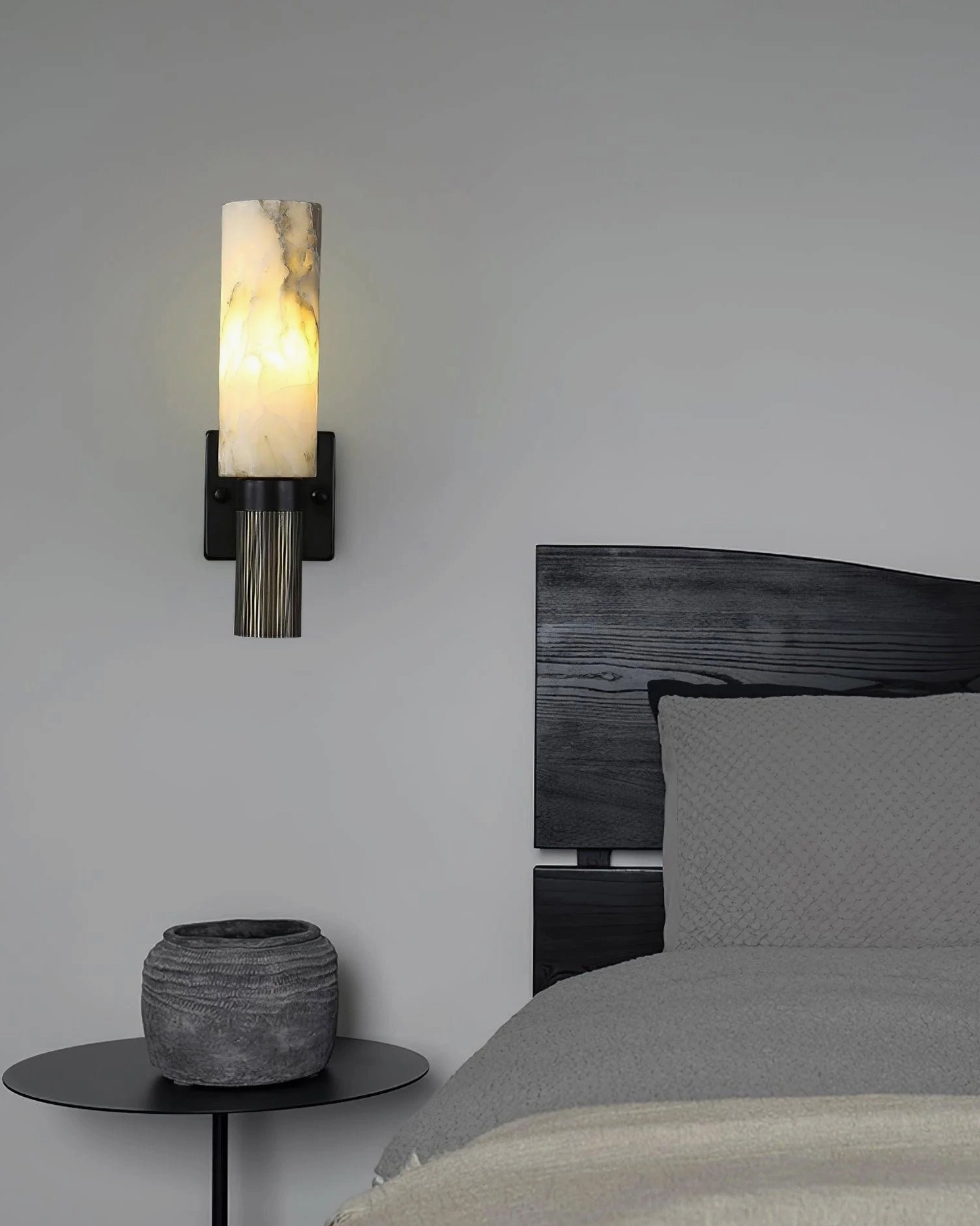 Translucent alabaster lamp shade backlit showing natural stone texture and light diffusion properties