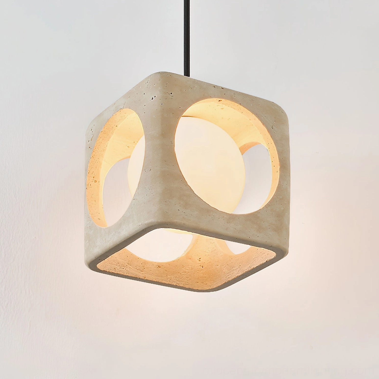 Three-head travertine pendant light installation in contemporary open-plan living and dining space