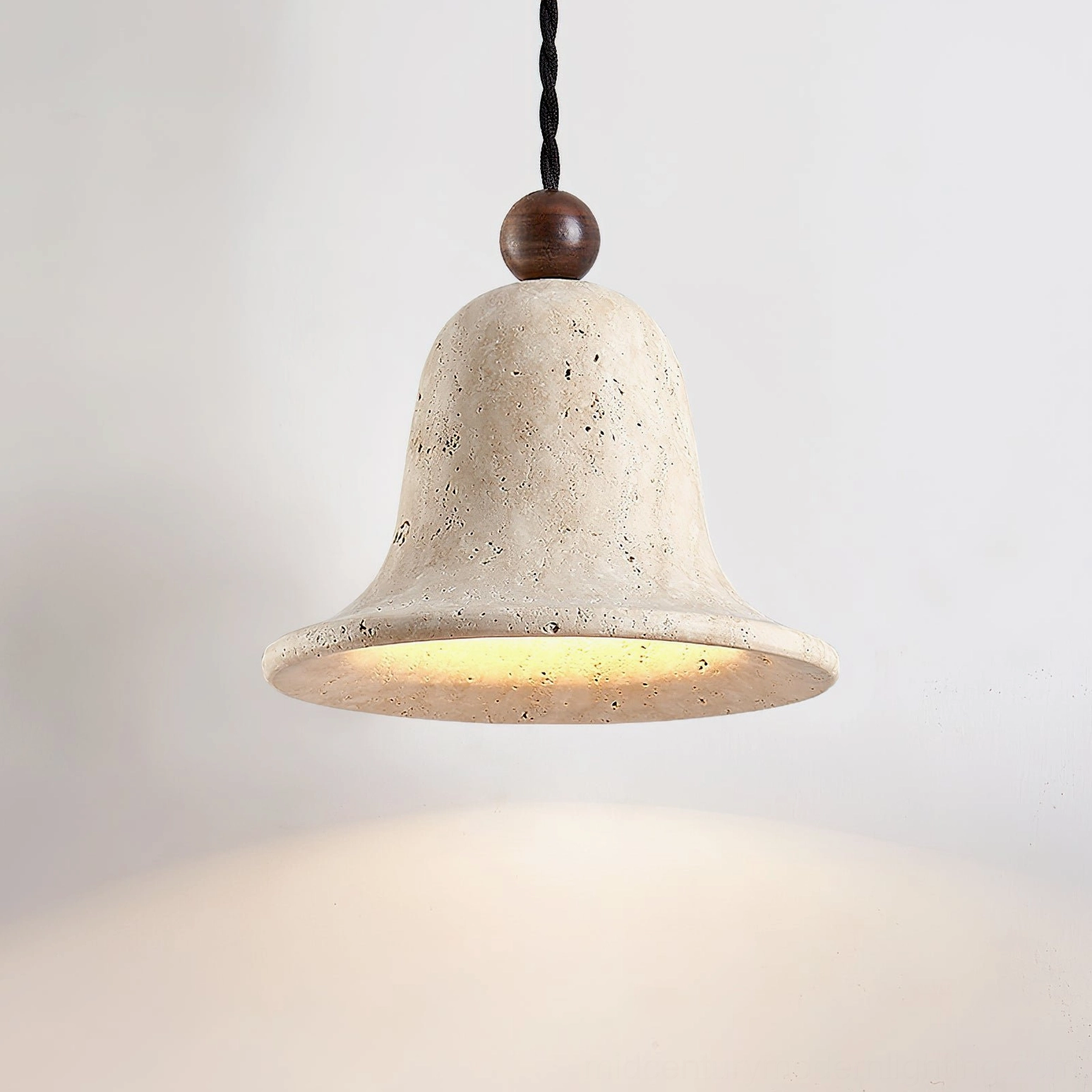Travertine bell pendant with walnut wood accent bead detail on twisted suspension cord