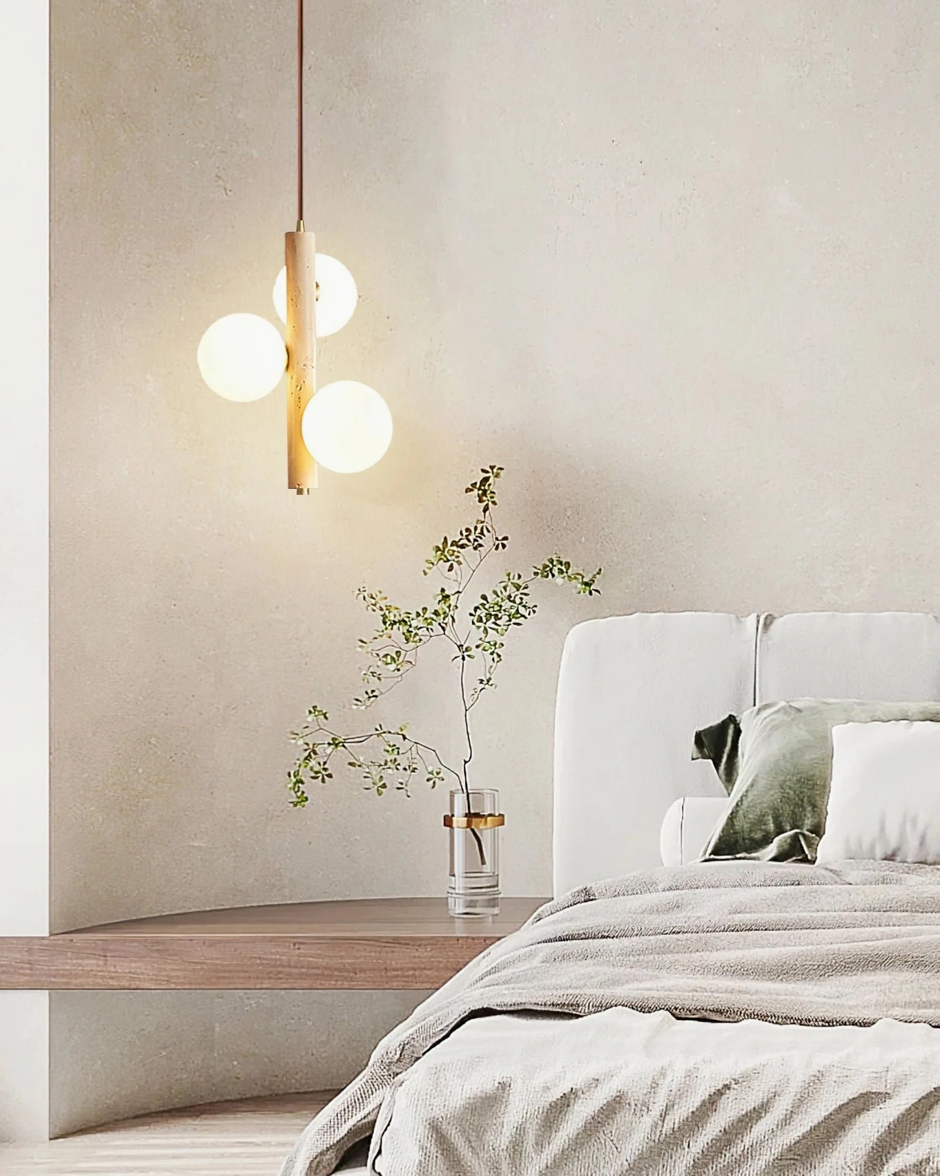 Travertine bubble pendant light mounted above minimalist bedroom bedside table, creating warm ambient bedroom lighting