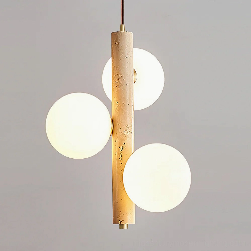 Close-up of travertine bubble pendant lamp illuminated, highlighting warm glow through frosted glass and porous stone texture details