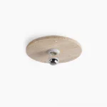 Travertine flush mount ceiling light - overhead flat lay detail showing natural stone porous texture and organic surface variation