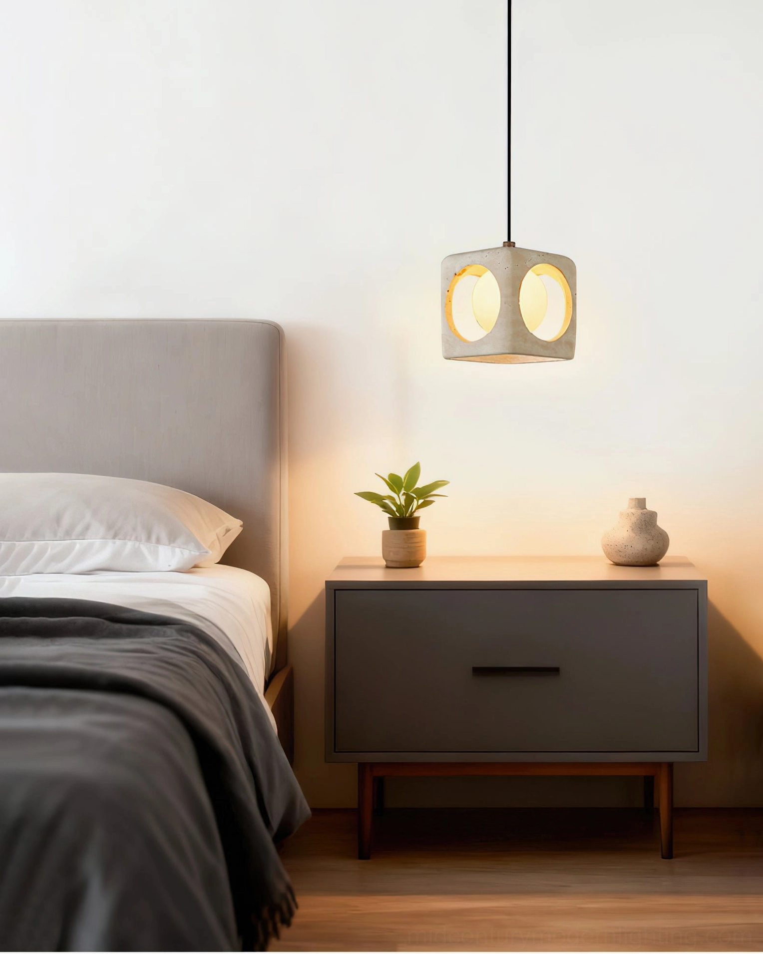 Single travertine pendant light hanging above modern minimalist bedroom bedside, soft wabi-sabi aesthetic