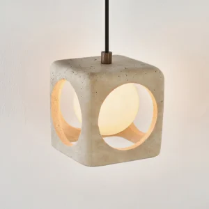 Close-up side view of travertine pendant revealing exposed aggregate texture and warm internal LED glow through frosted glass diffuser