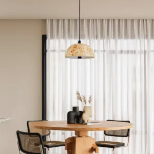 Morphe natural stone pendant light installed above modern dining room wooden table