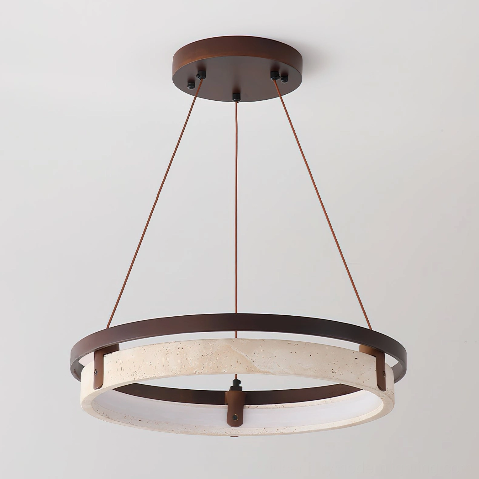 Travertine ring pendant light with warm LED glow showing circular design and fabric hanging cord from below