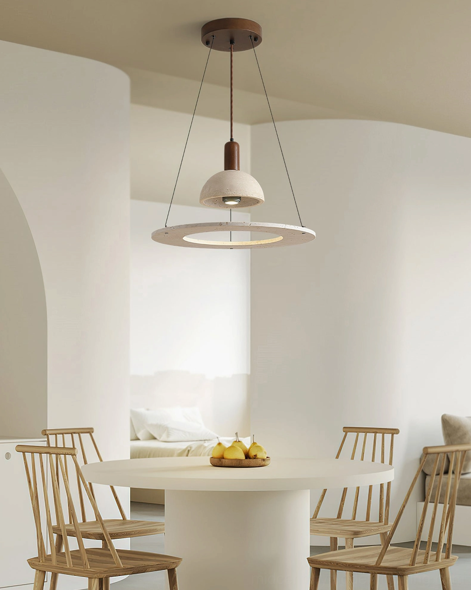 Travertine pendant light casting warm glow in bright modern lounge dining space with natural lighting