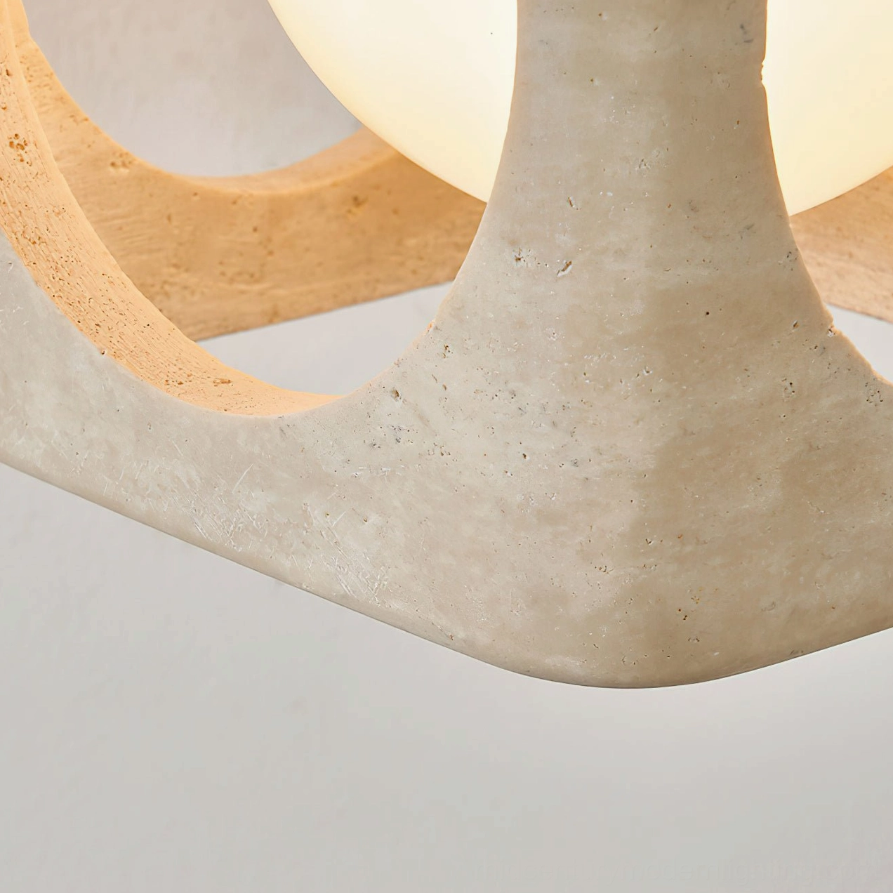 Travertine stone pendant fixture overhead view demonstrating light diffusion and shadow patterns