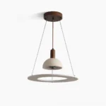 Travertine dome pendant light with walnut wood ring on white background, showcasing sculptural form and natural stone texture