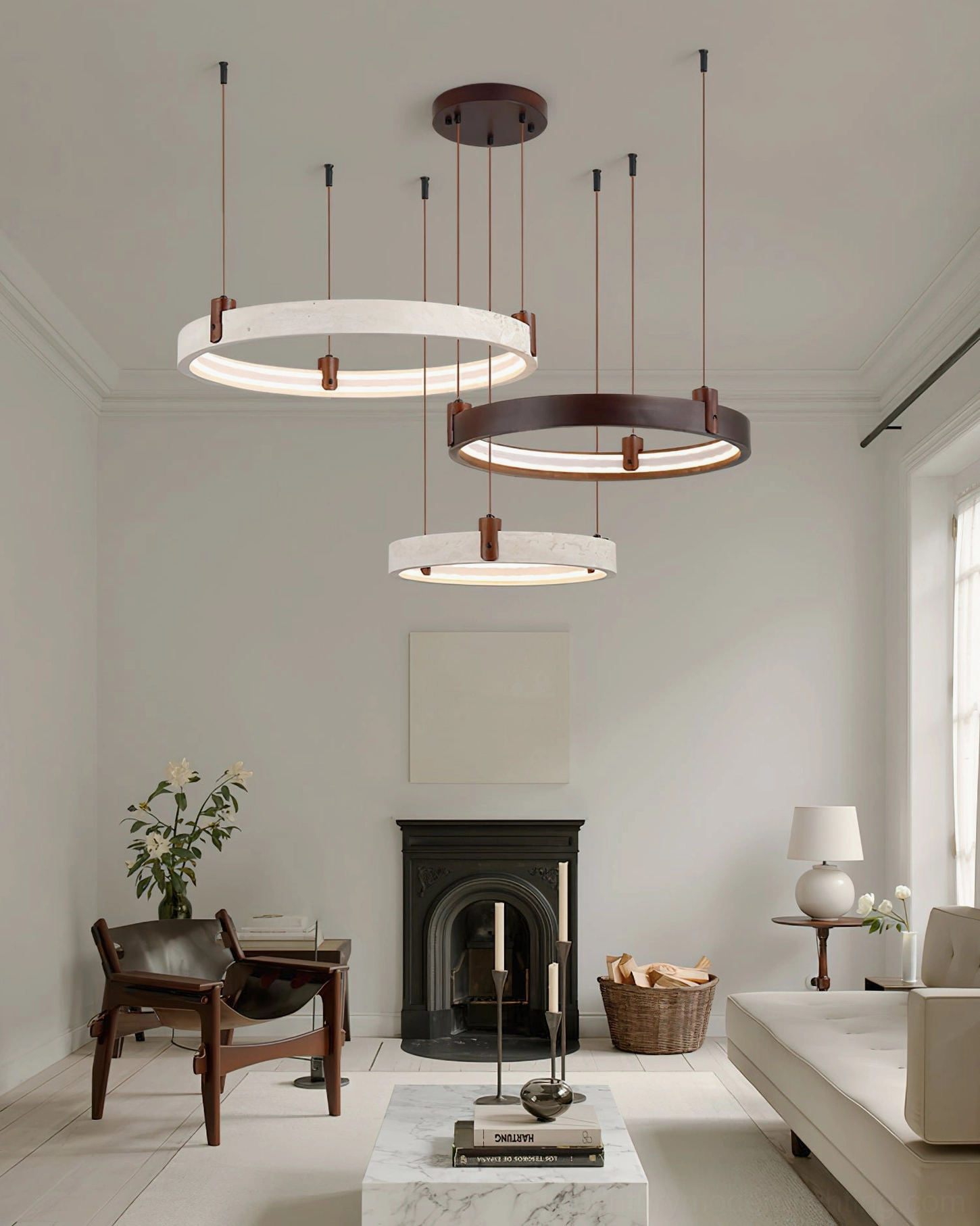 Modern sculptural travertine ring chandelier above fireplace in cozy neutral living room, demonstrating versatile mid-century contemporary styling