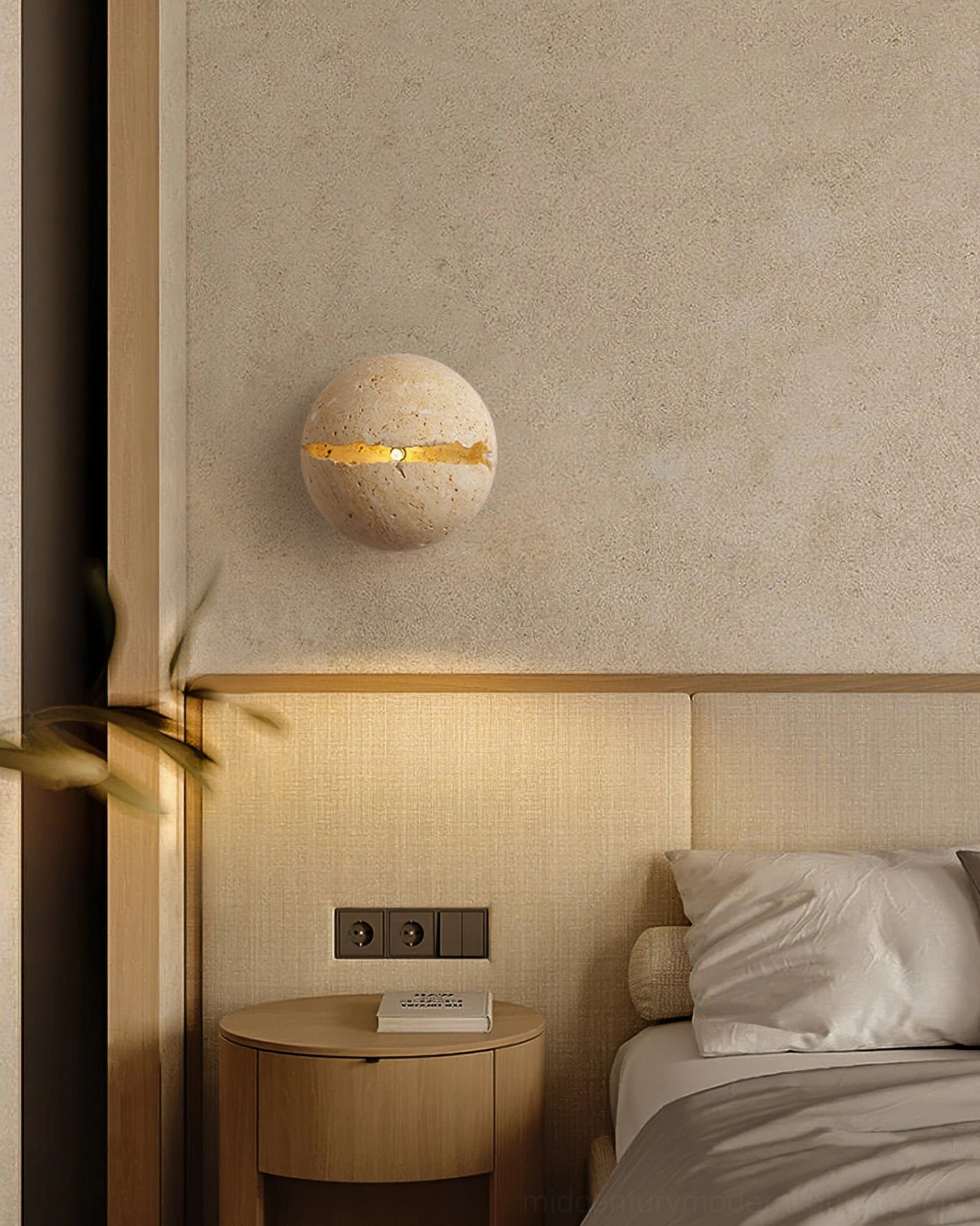 Round travertine wall sconce product detail showing stone finish, crack pattern, and lighting feature