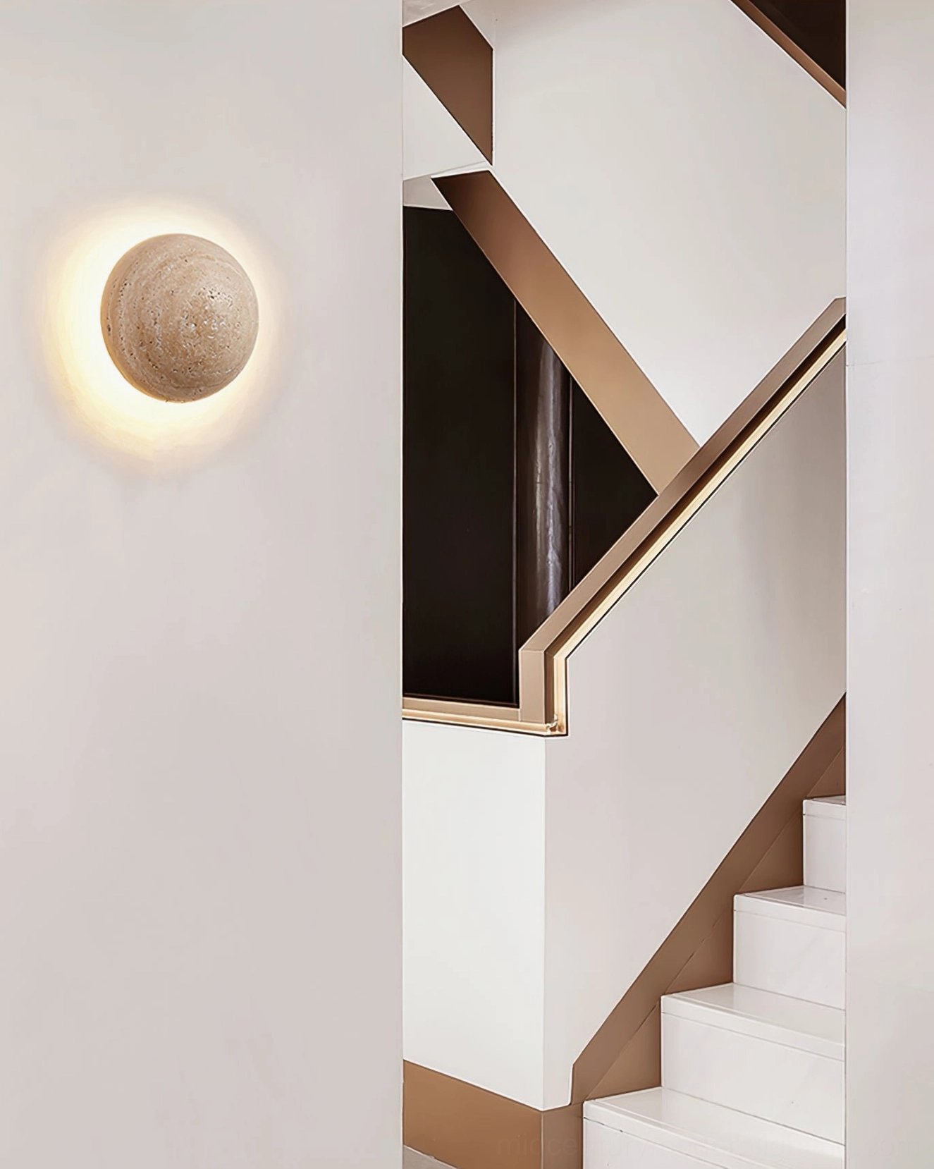 Travertine round wall lamp creating warm back lighting effect in residential stairwell corridor