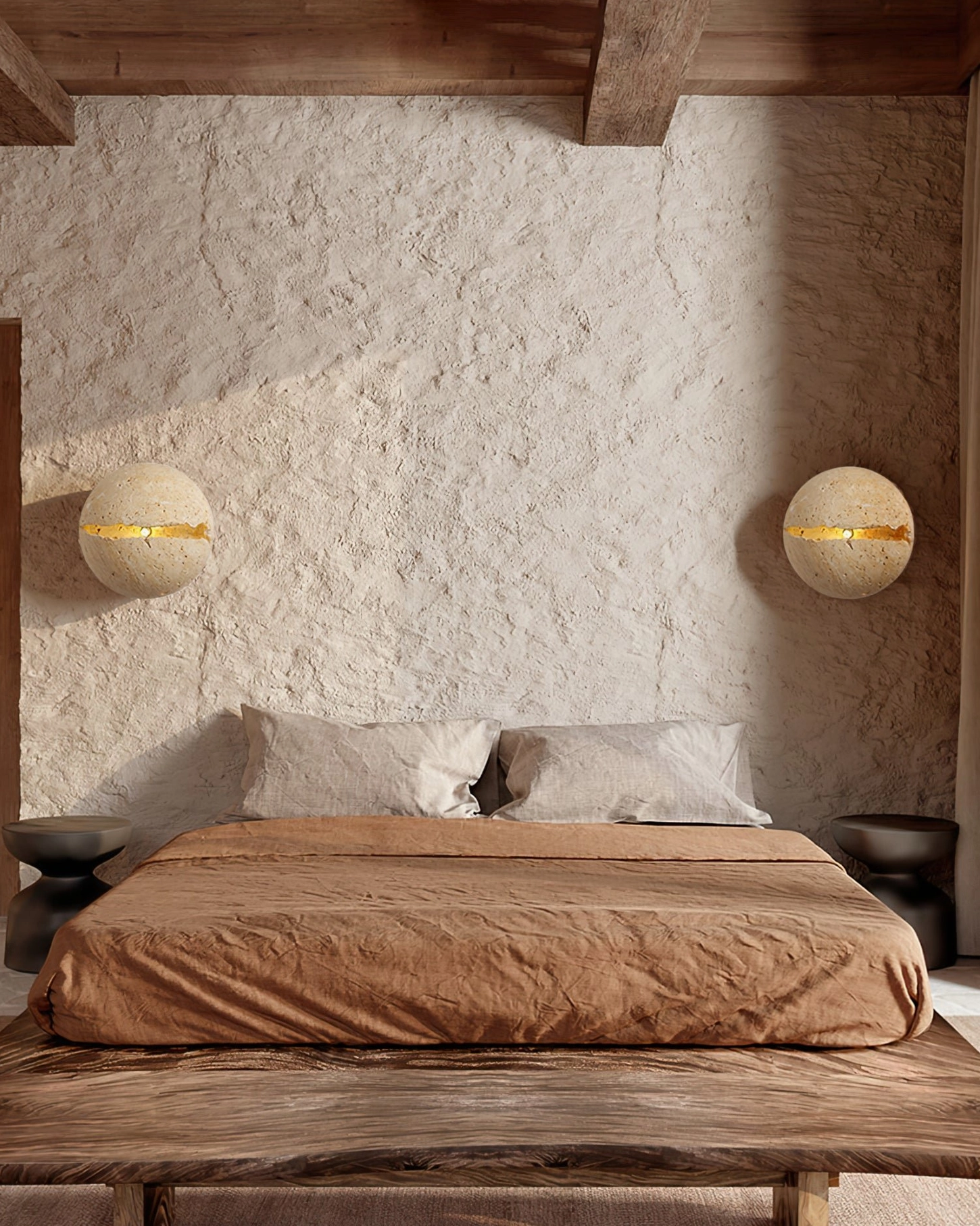 Modern round travertine wall sconce sculptural form and natural stone character in interior setting