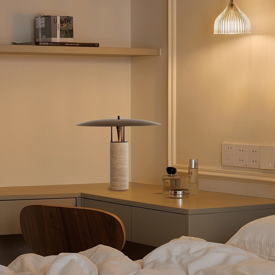 Travertine table lamp on bedroom bedside desk with skincare decor and warm ambient indoor lighting, relaxation space