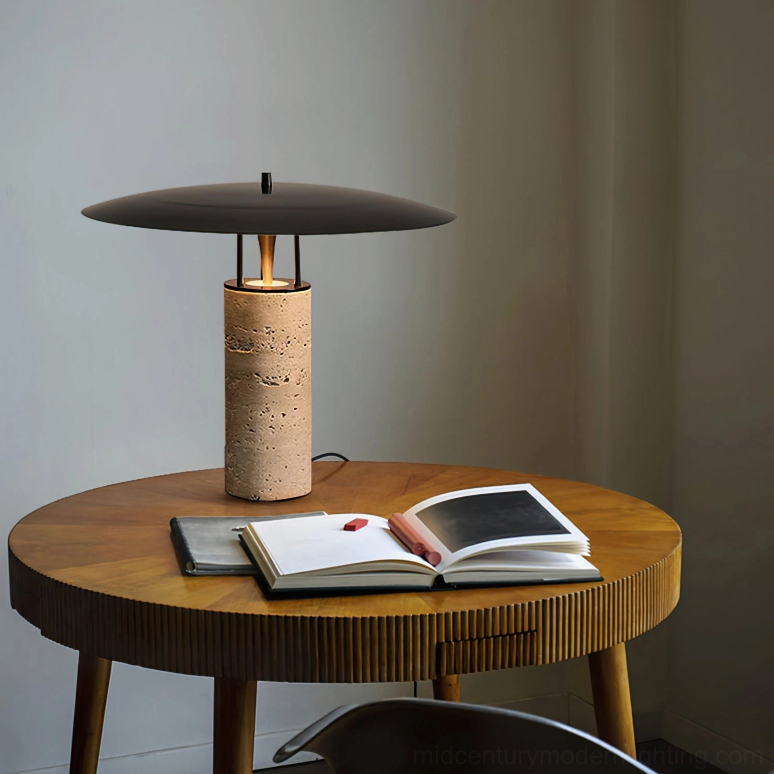 Travertine table lamp displayed on round wooden side table with open books and warm ambient lighting, home decor styling