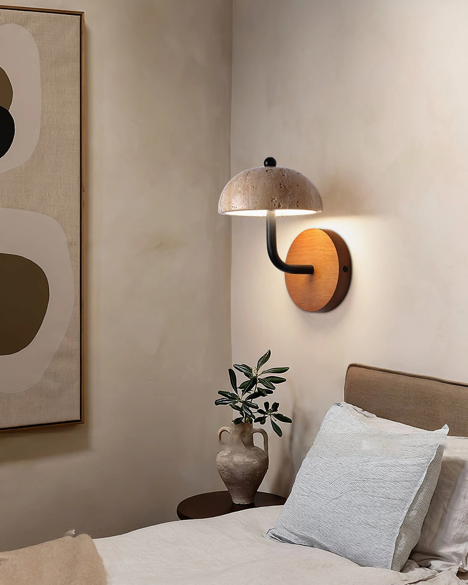warm stone wall lamp as bedside accent lighting in minimalist bedroom nook
