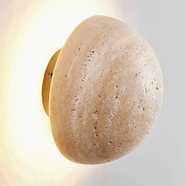 Travertine wall sconce mounted display showing size scale and circular form proportions