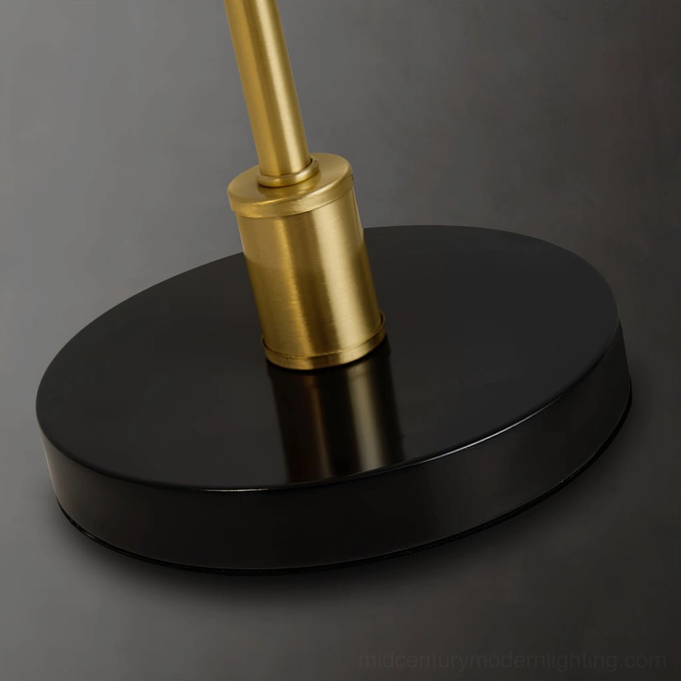 Tresa modern desk lamp showing conical brass shade and functional task lighting capability