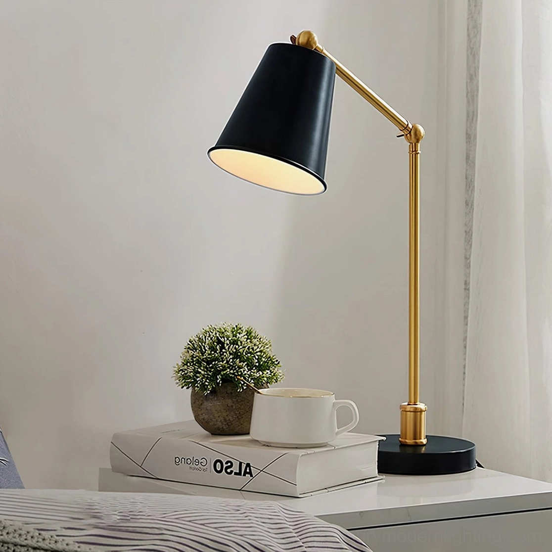 Tresa brass desk lamp three-quarter angle view showing conical metal shade and articulated arm on bedside table