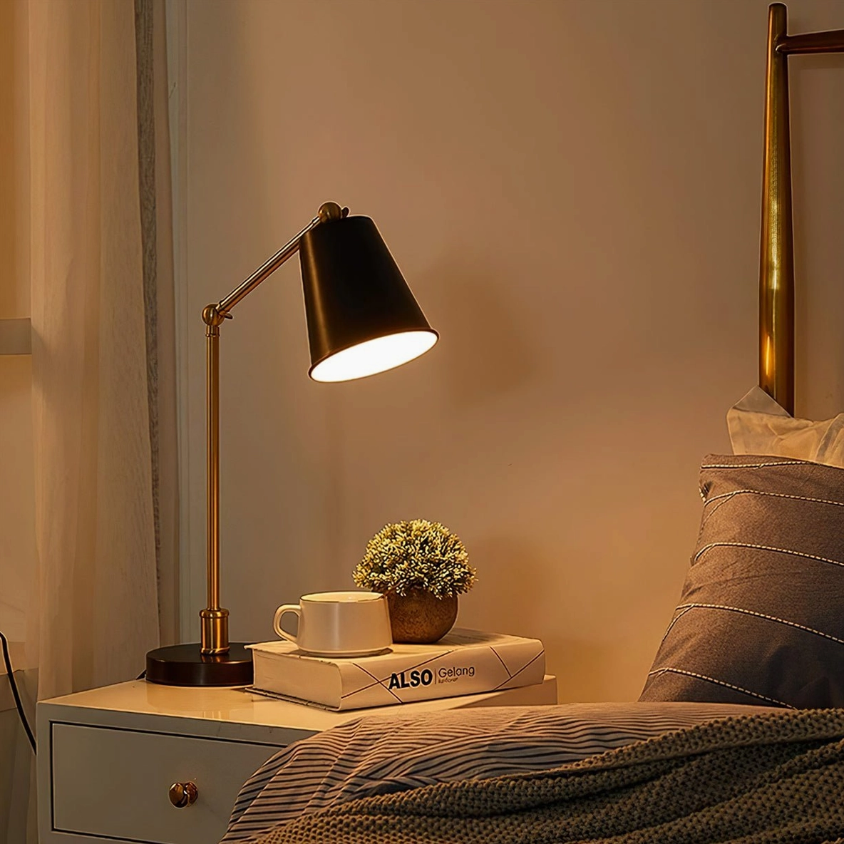 Tresa adjustable brass table lamp illuminated in warm ambient lighting bedroom nightstand scene