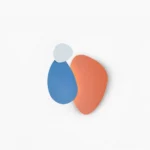 Tria modular LED wall lamp with geometric pebble-shaped design in multicolor finish on white background