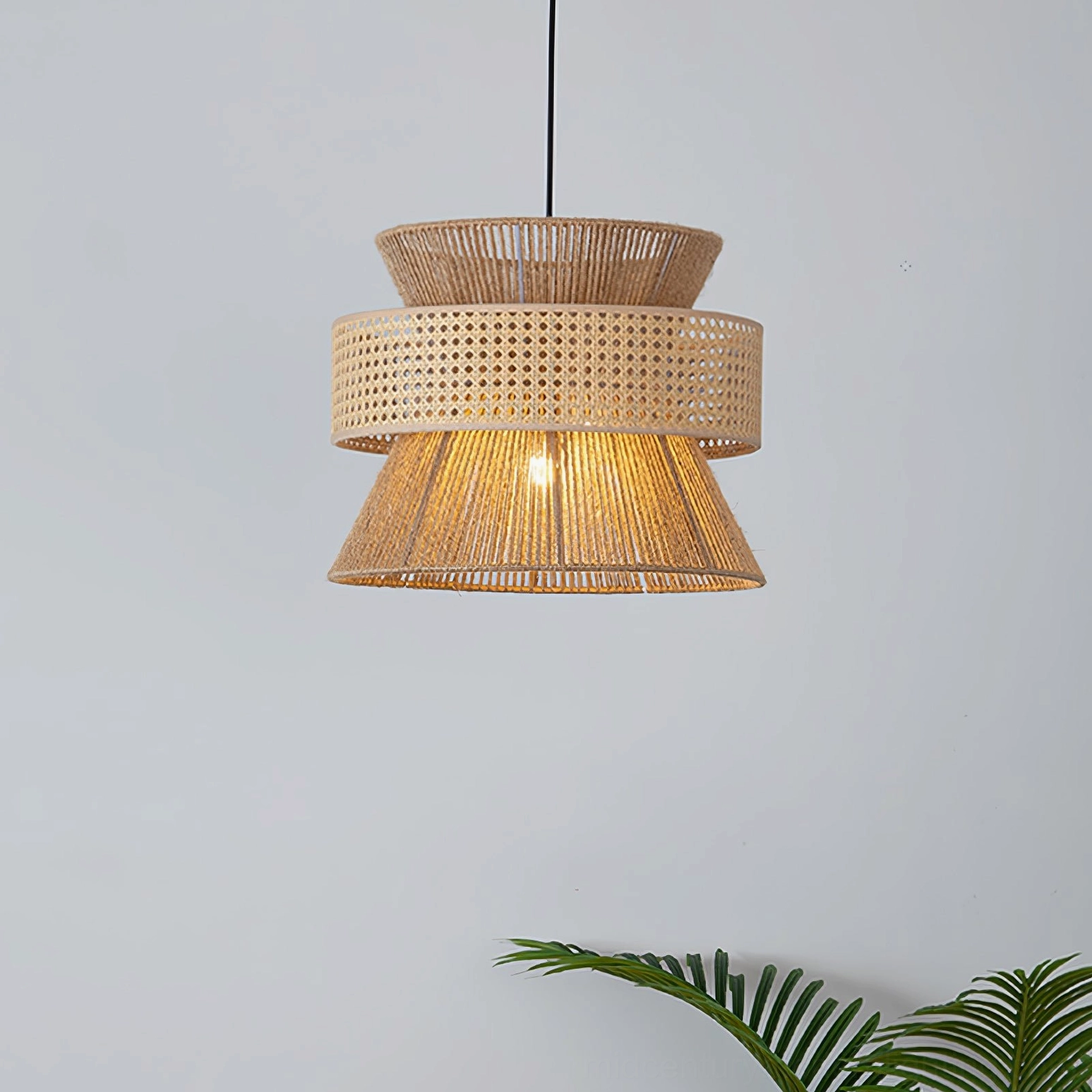 Natural handwoven rattan tiered pendant lamp with symmetrical silhouette and open-weave construction