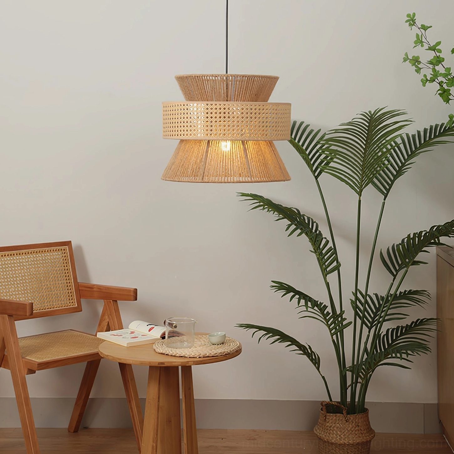 Three-tier rattan pendant light installed in bohemian dining room with natural textiles and potted palm plants