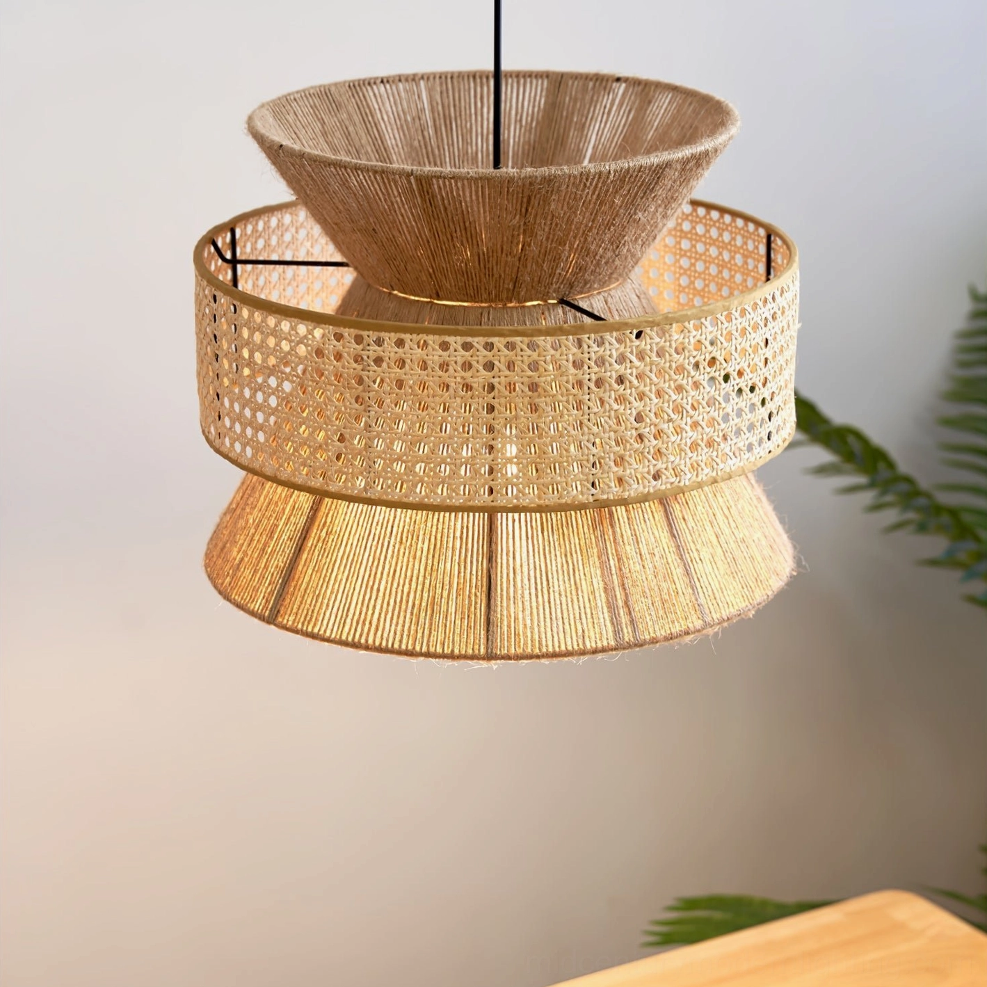 Tiered woven rattan pendant shade highlighting handcrafted quality and sustainable natural materials